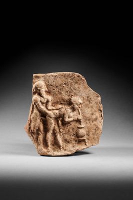 a roman terra relief of a man and a woman