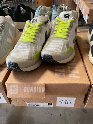several pairs of running shoes are on display in a shoe store