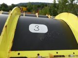 a black and yellow trash can with a number 3 on it