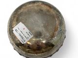 a small metal object with a tag on it