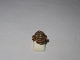 a close up of a gold ring with a diamond on it