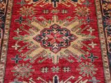an oriental rug with a red and blue design on it
