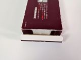 a small red book sitting on top of a white table