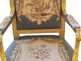 an image of a blue and gold chair with a floral design on it
