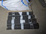 a pile of black and white pipes sitting on a pallet
