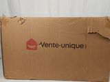 a cardboard box that is sitting on a bed