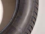 a close up of a tire on a white surface