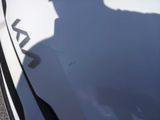 a shadow of a man on the hood of a car