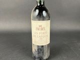 a bottle of wine that is sitting on a table