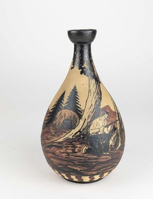 a vase with a painting on it sitting on a table