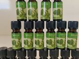 a pile of bottles of essential oils sitting on top of a table