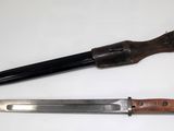 a knife and a knife holder on a table