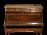 a small writing desk with a drawer on top of it