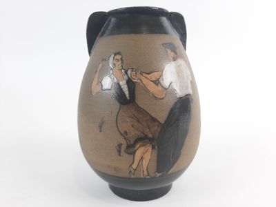 a brown vase with a painting of a man and a woman on it