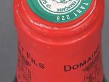 a close up of a bottle of wine on a table