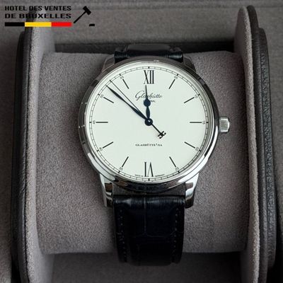 a watch that is sitting in a box on the table
