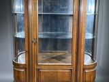 an image of a wooden display cabinet with glass doors