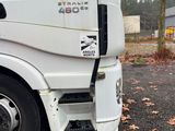 a white truck that is parked on the side of the road