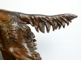 a statue of a man with a goat ' s head on it ' s back