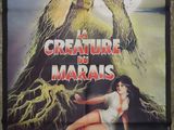 a poster for a horror movie starring a creature and a woman