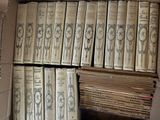 a box full of old books sitting on a table