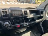 a dashboard of a truck with a clock on it