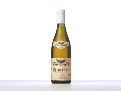 a bottle of white wine sitting on top of a table