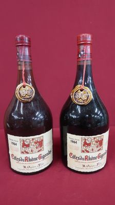 three bottles of wine sitting next to each other on a red surface