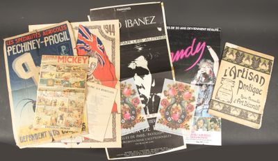 a lot of old movie posters on the table