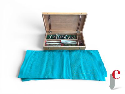 a wooden box with a bunch of small items inside of it