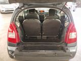 three seats in the back of a car with the trunk open