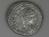 a silver coin with an image of a woman on it