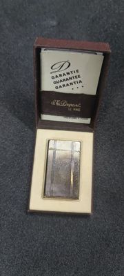 a small silver plate in a box on a table