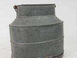 a metal container that is sitting on the ground