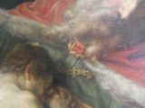 un tableau représentant le Père Noël tenant un enfant dans ses bras