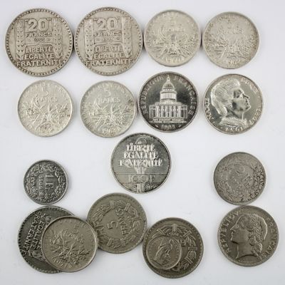an image of a bunch of coins sitting on top of a white surface