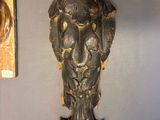 two wall sconces hanging on the wall next to each other