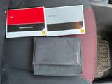 a wallet and a wallet case in the back seat of a car