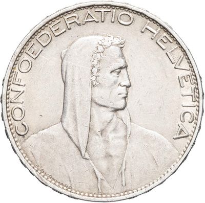an old silver coin with a portrait of a woman wearing a headscarf