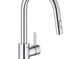 a close up of a kitchen faucet with a white background