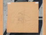 an old picture of a cardboard box with a drawing of a man on it