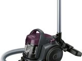 the vacuum is purple and silver with a hose attached to it