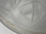 a glass plate with a design on it sitting on a table