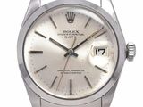 une photo d'une montre Rolex en acier inoxydable avec un cadran blanc