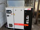 a machine that is sitting in a garage next to a wall