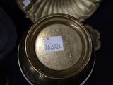 a close up of a gold vase with a label on it