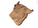 an image of a brown cloth bag on a white surface