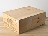 a wooden box that is sitting on a wooden floor