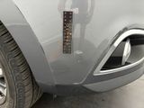 a close up of a car with a sticker on it ' s bumper