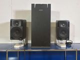 two speakers that are sitting on top of a table
